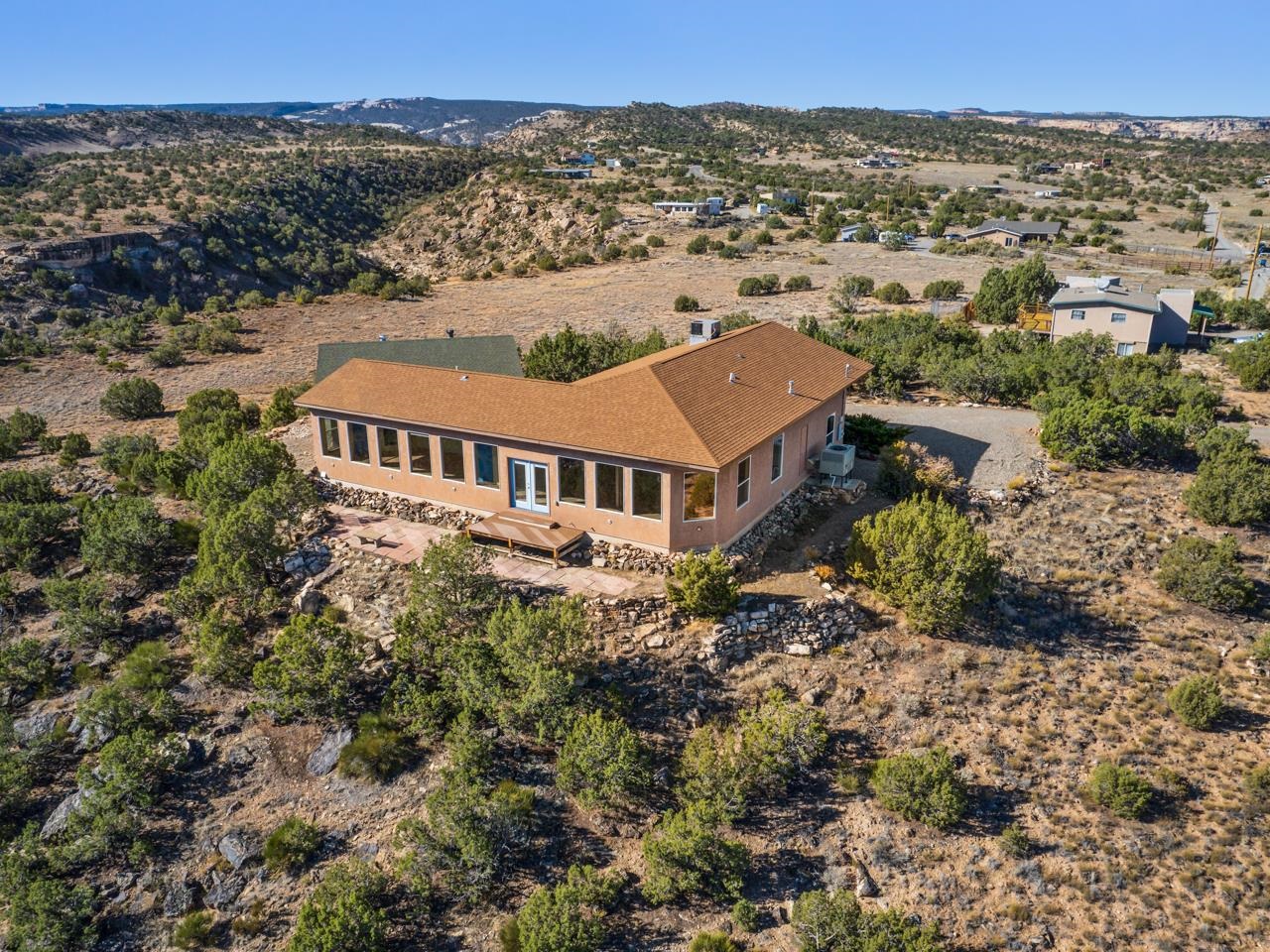 an aerial view of a house with a yard