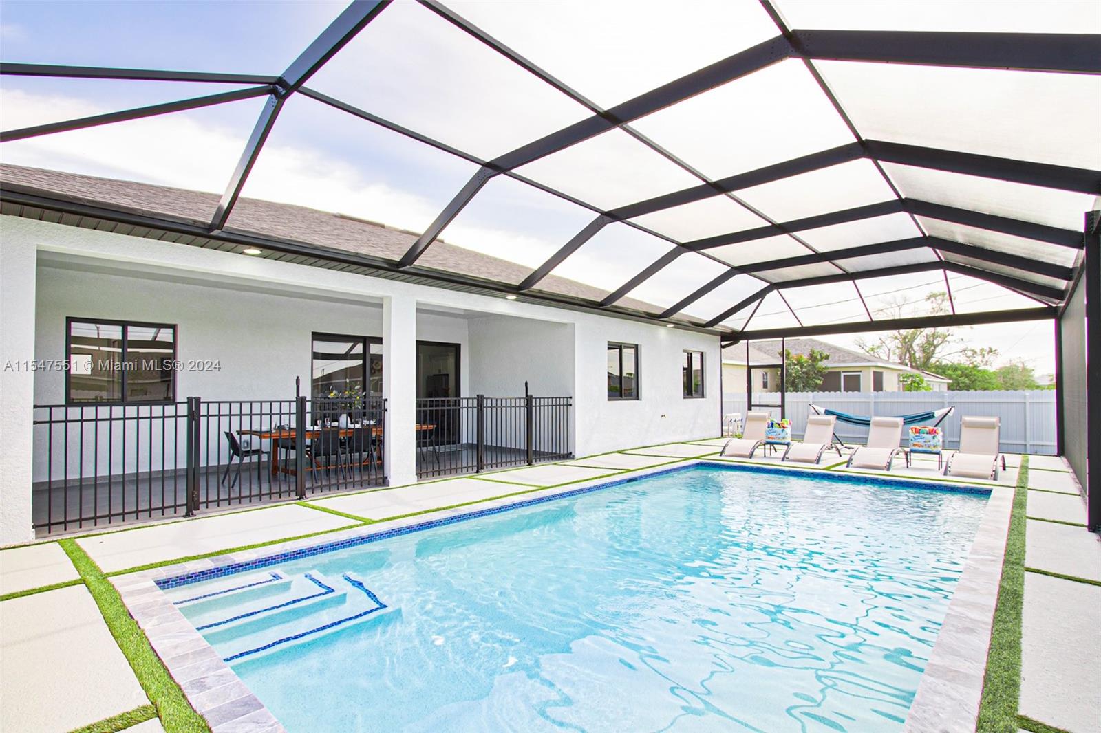 a view of swimming pool with seating area