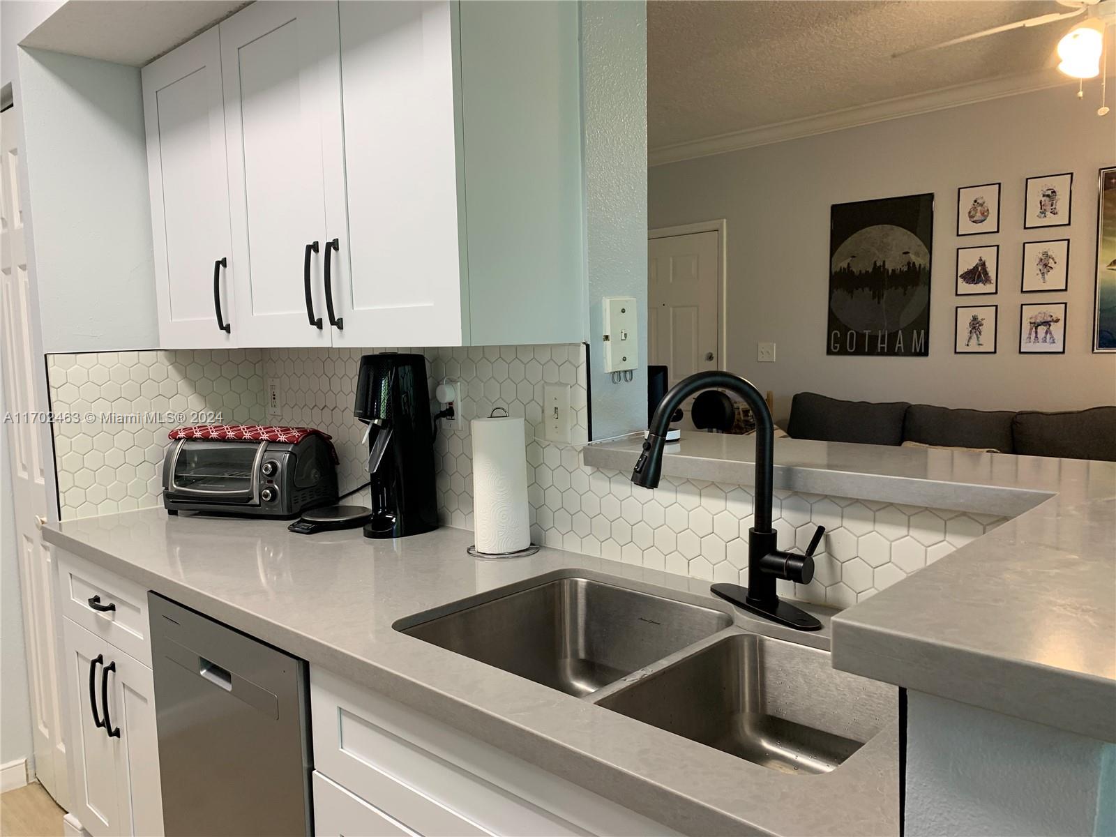 a kitchen with a sink and cabinets