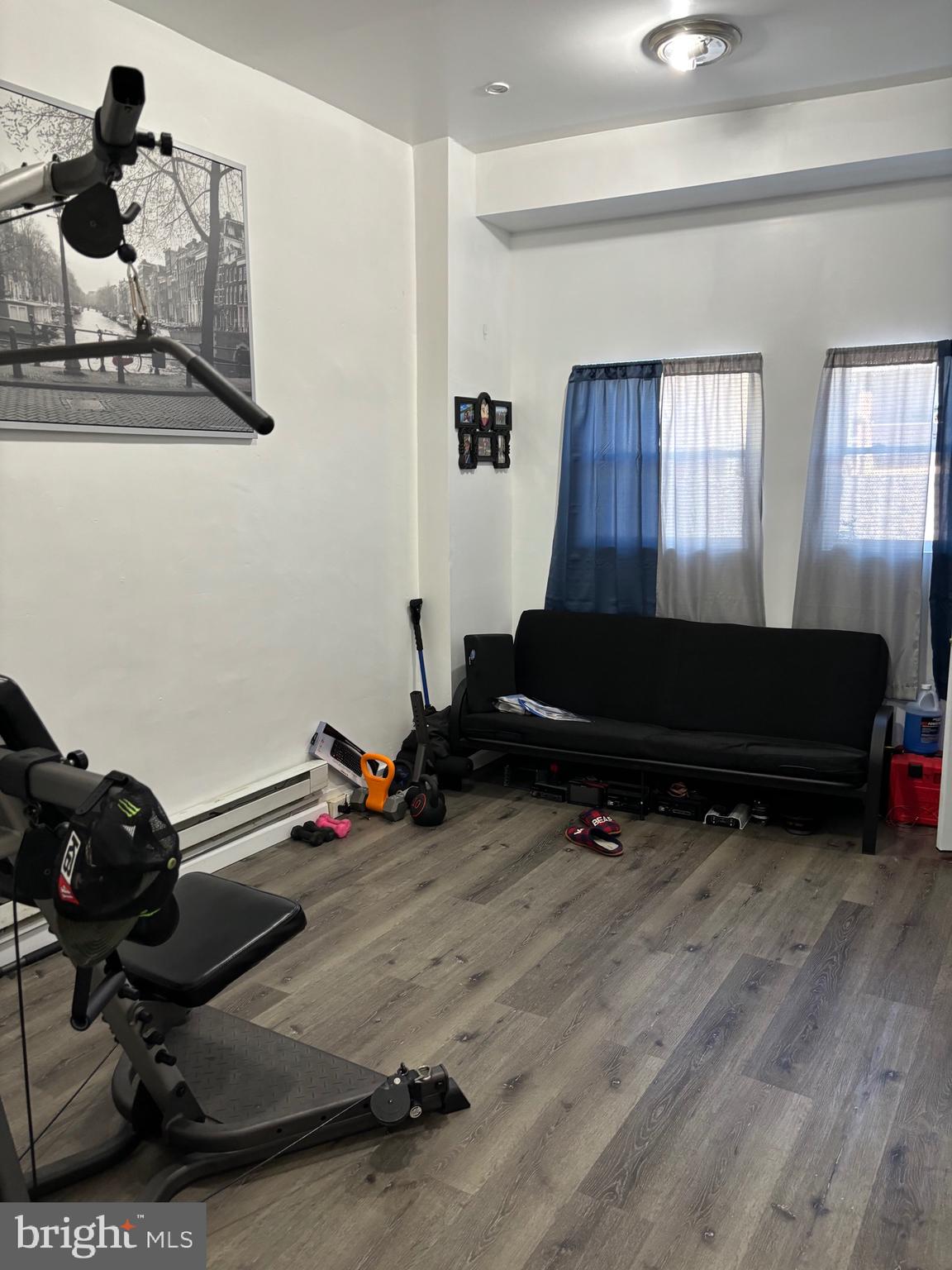 a room with gym equipment and a window