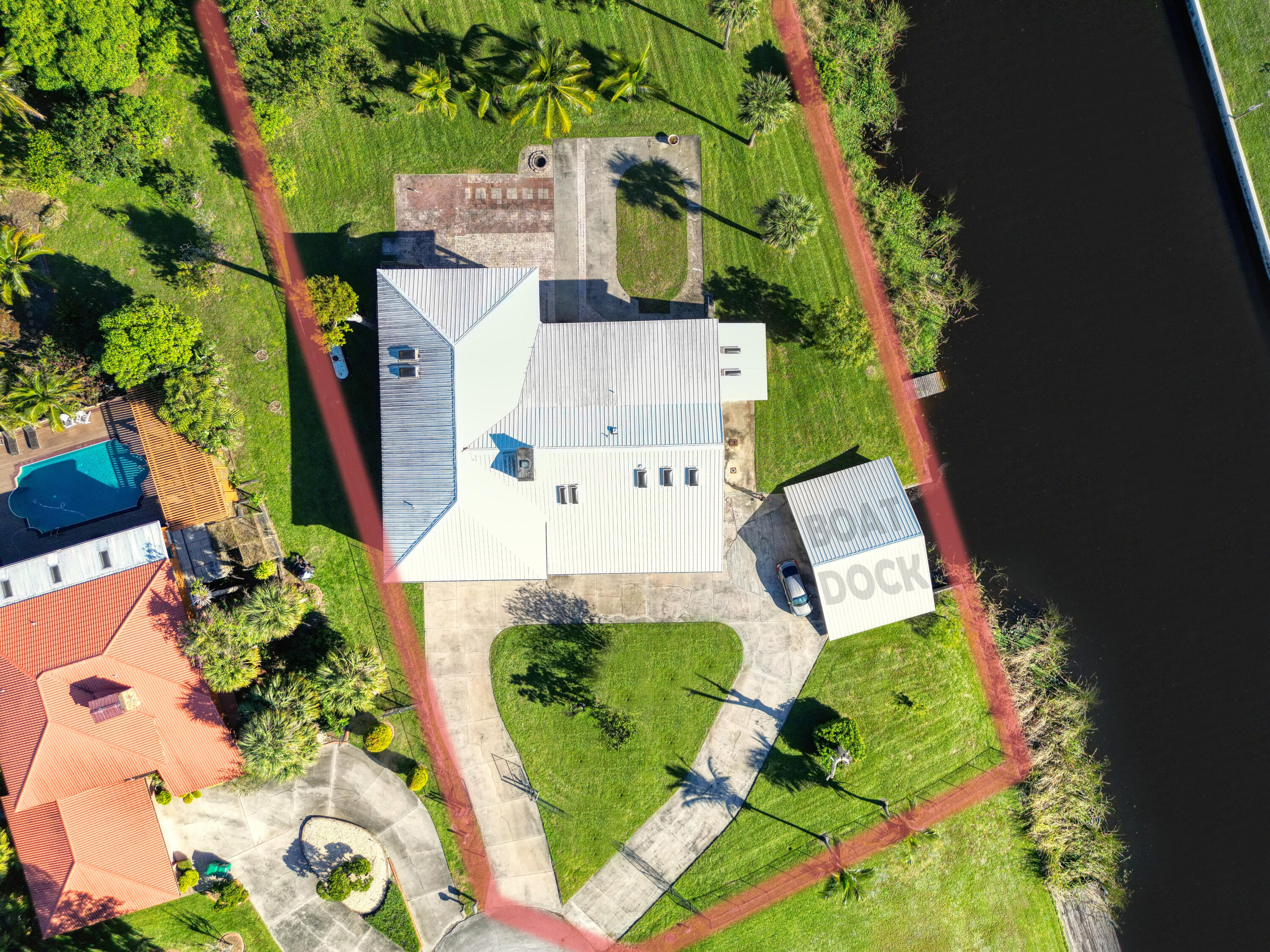 an aerial view of a house with a yard and garden