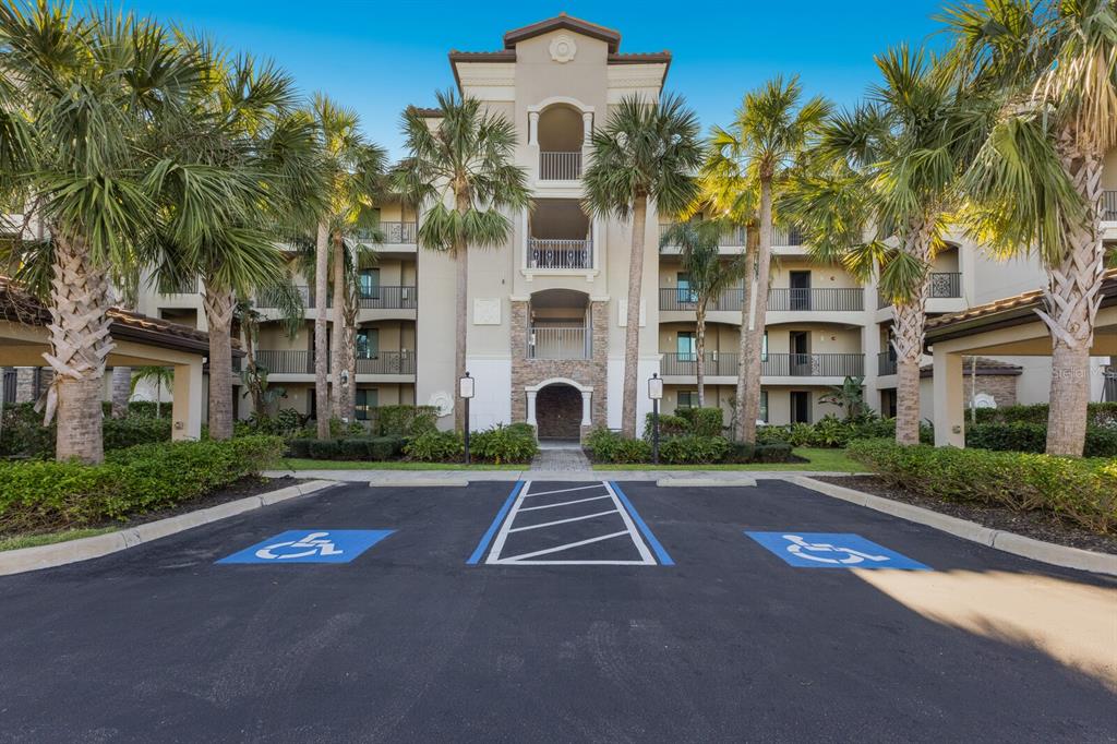 a front view of a residential apartment building with a yard