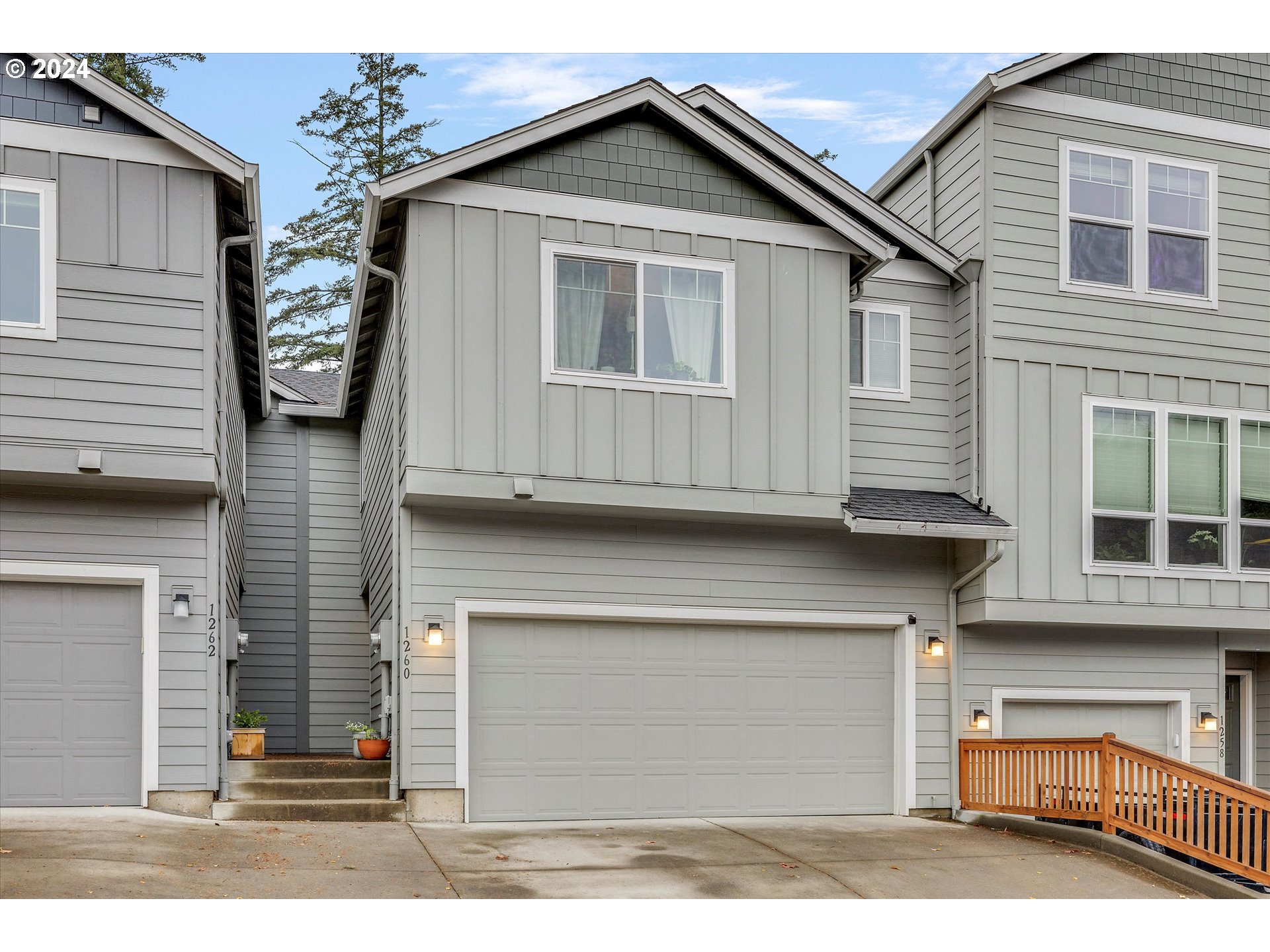 a view of a house with a parking area