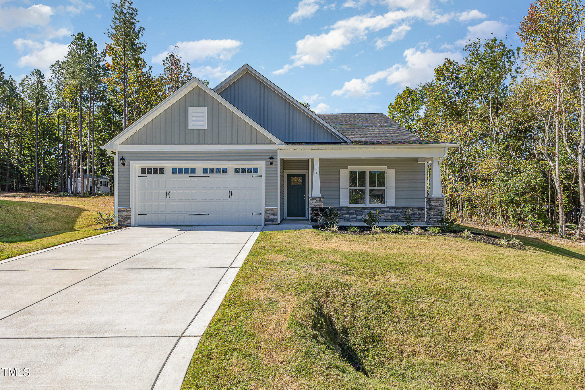 a view of garage and yard