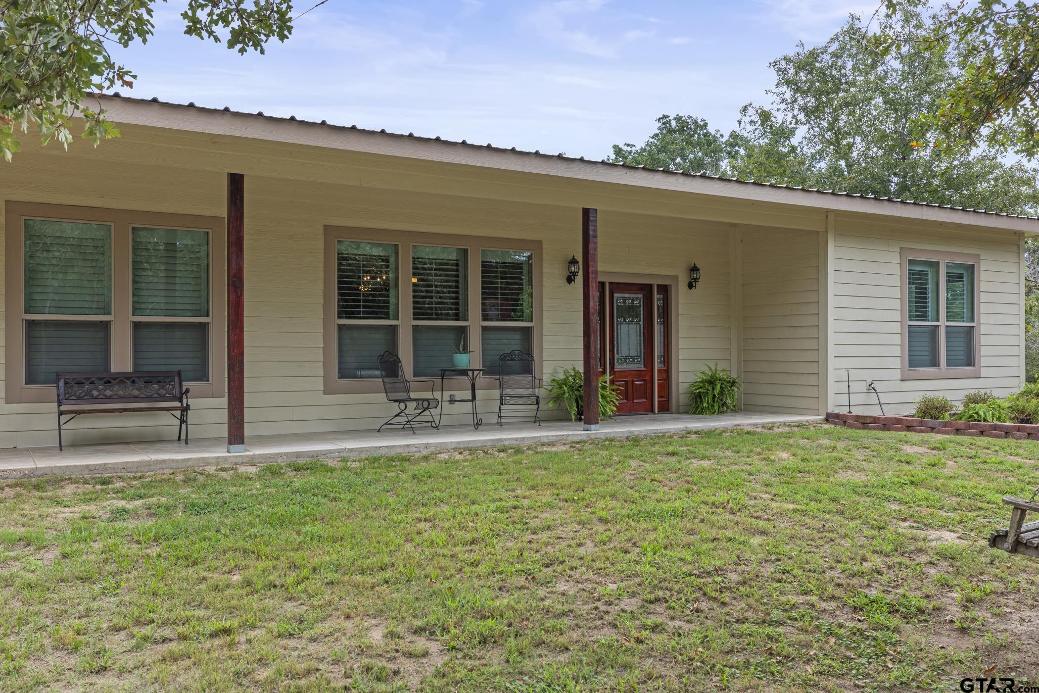 front view of a house with a yard