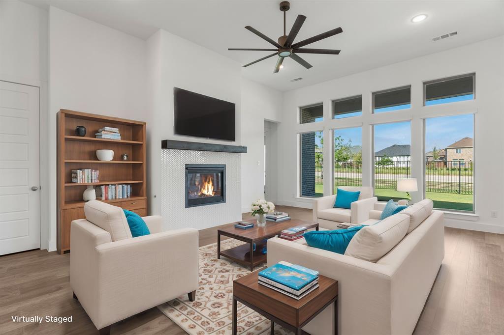 a living room with furniture fireplace and a flat screen tv