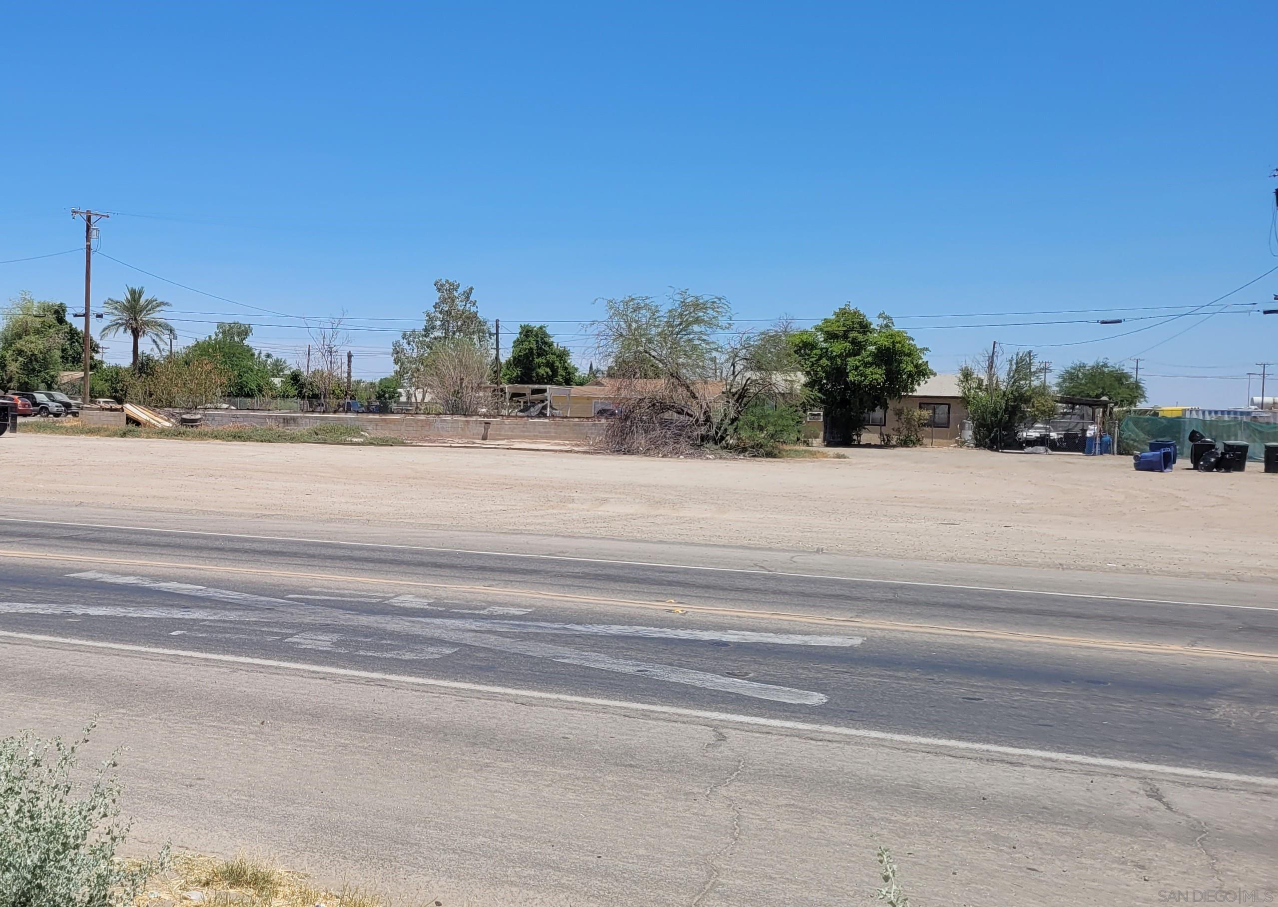 a view of a houses with a street view