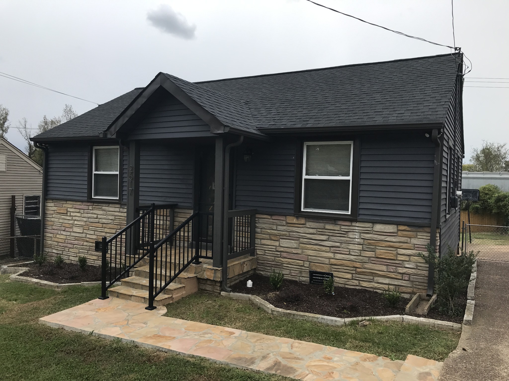 a front view of a house with garage