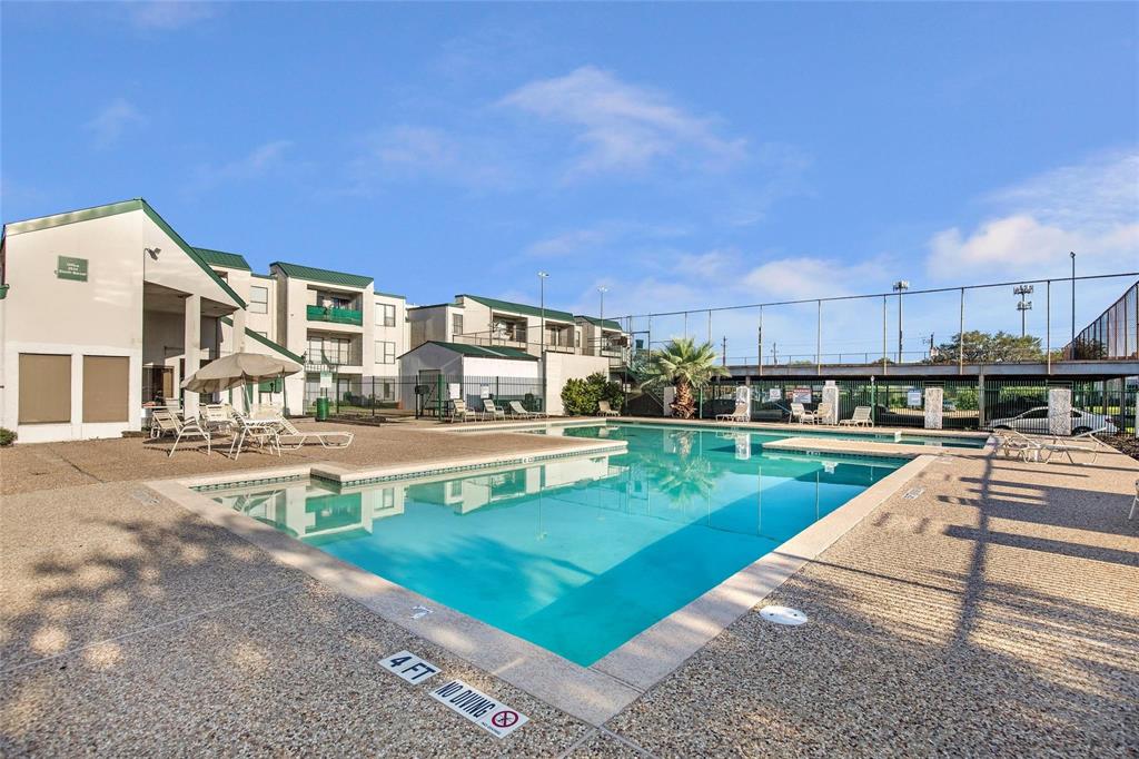 a view of a swimming pool with a patio