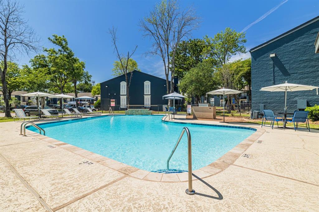 a swimming pool with outdoor seating yard and patio