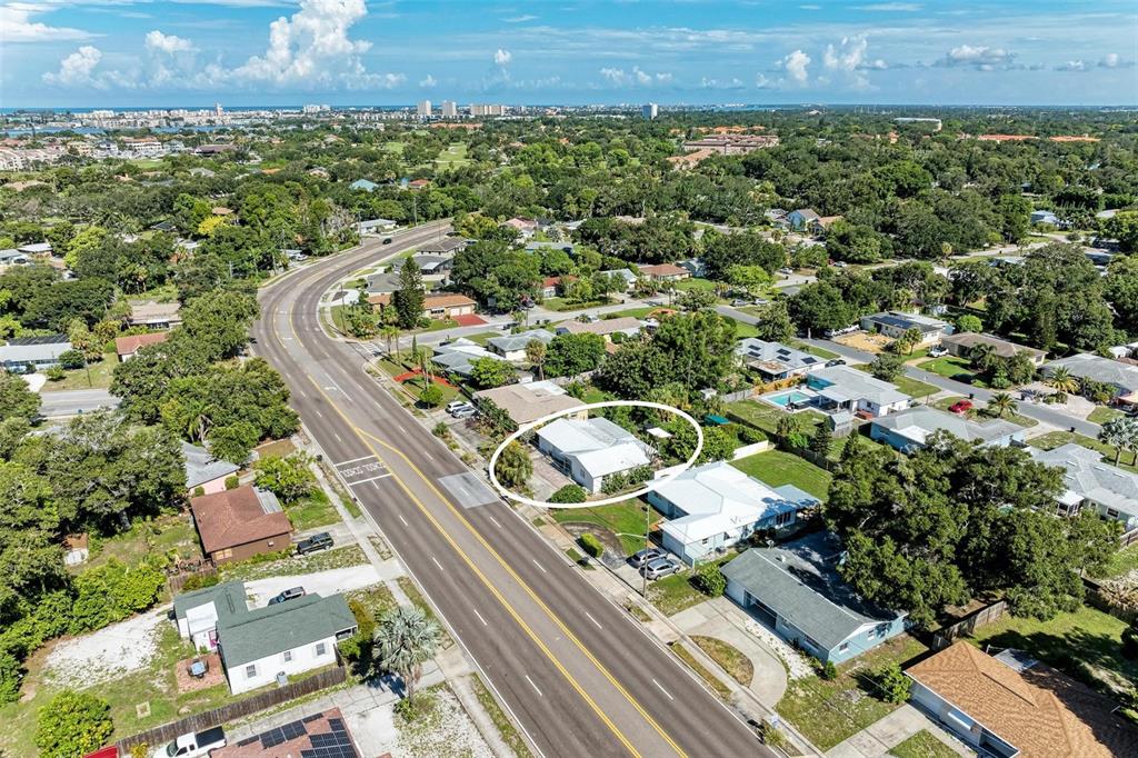 an aerial view of residential houses with outdoor space