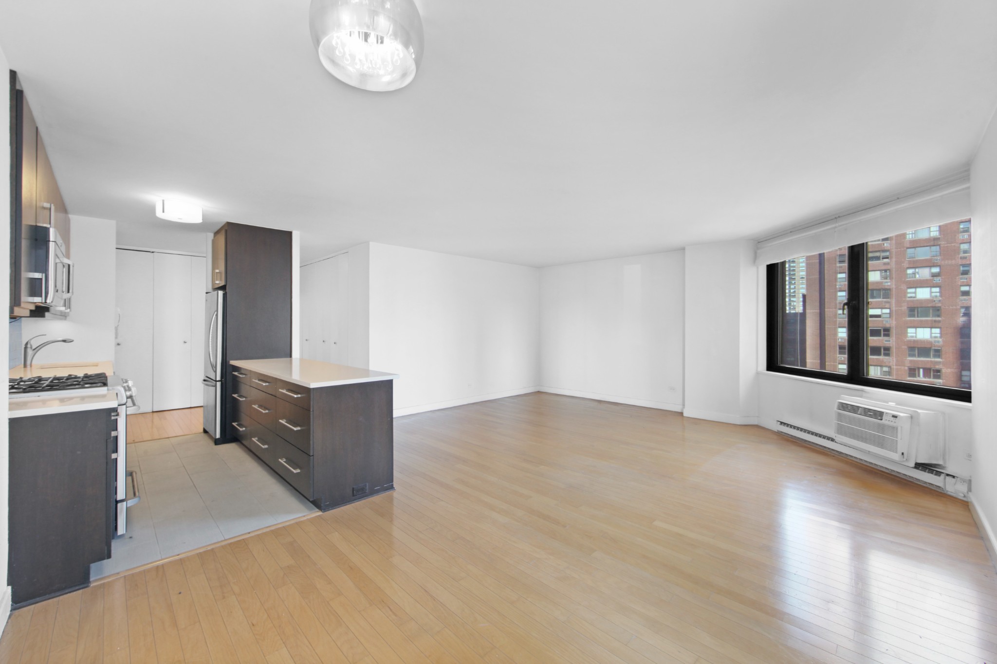 a view of an empty room with a window