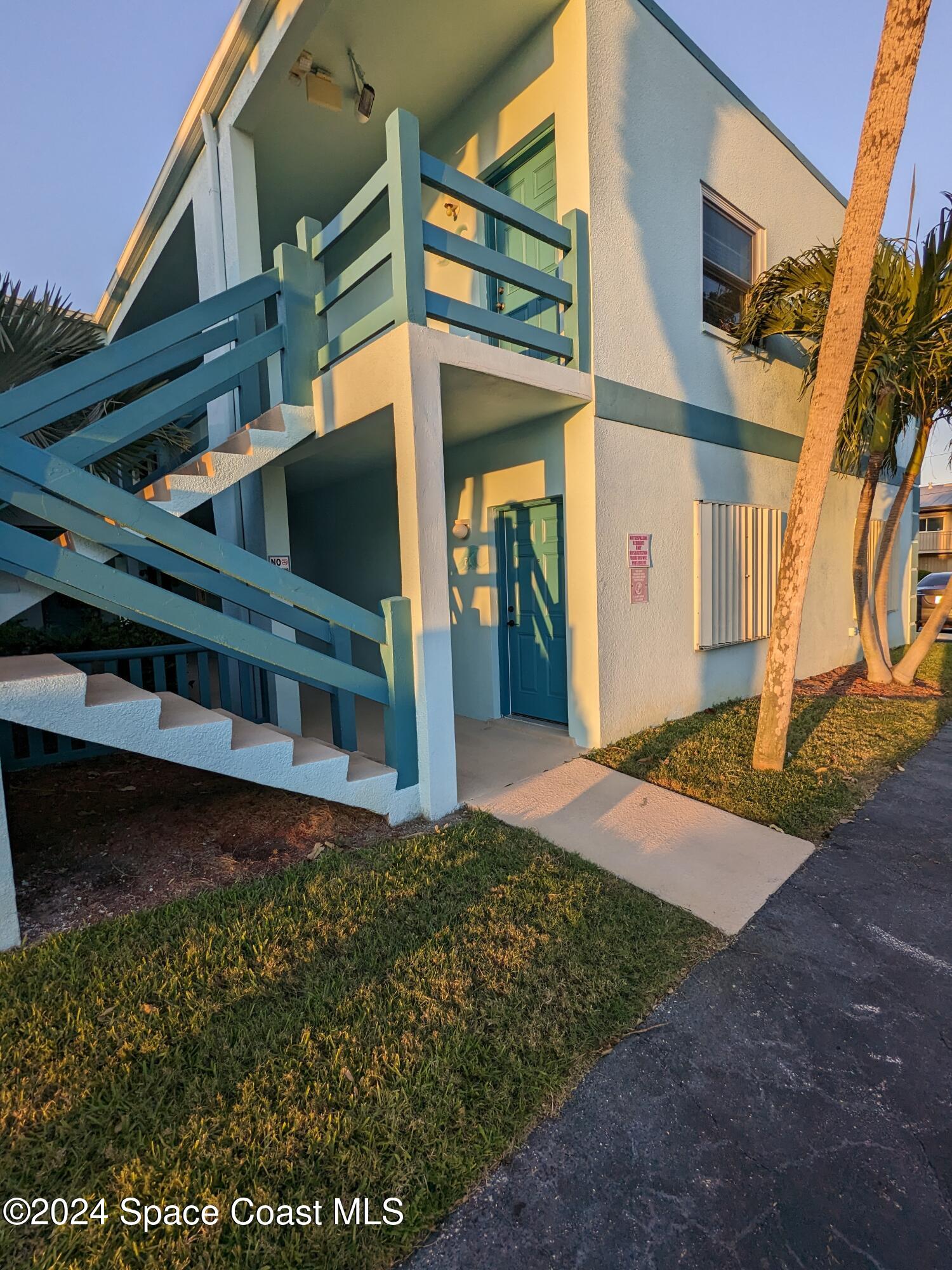 a view of a house with a small yard