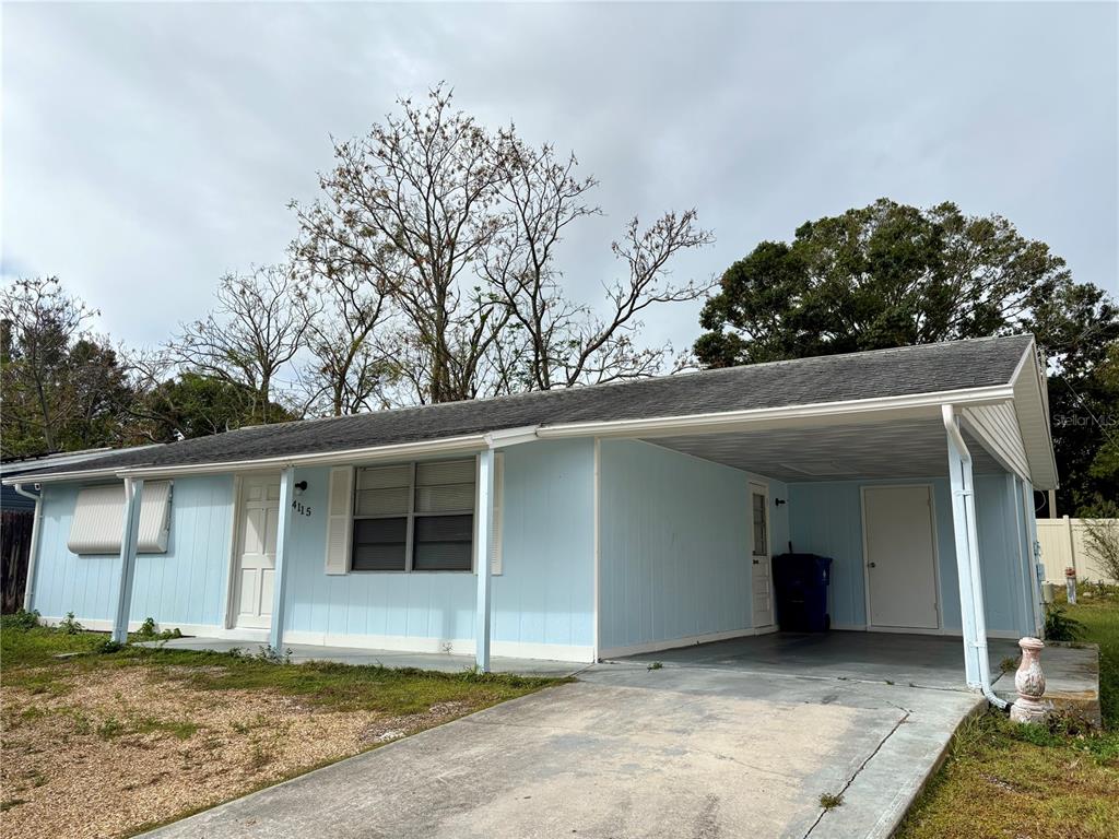 a house with trees in the background