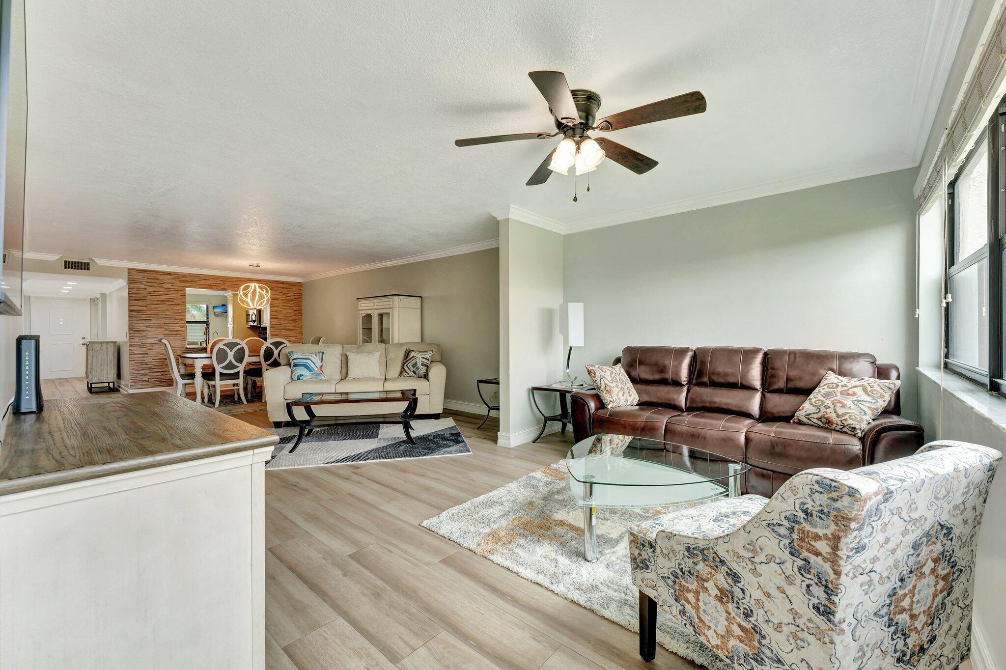 a living room with furniture and a view of living room