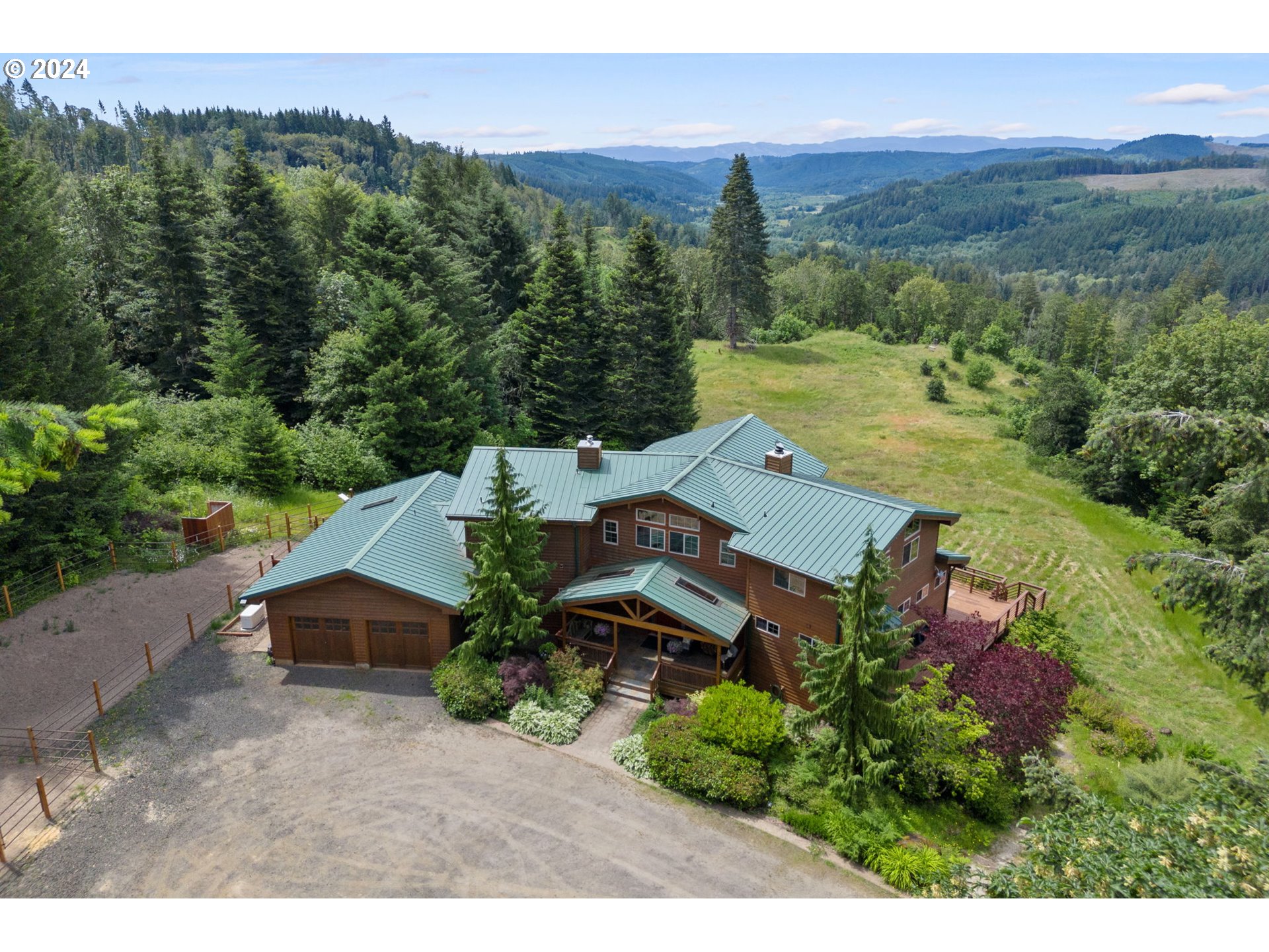 an aerial view of a house with mountain view