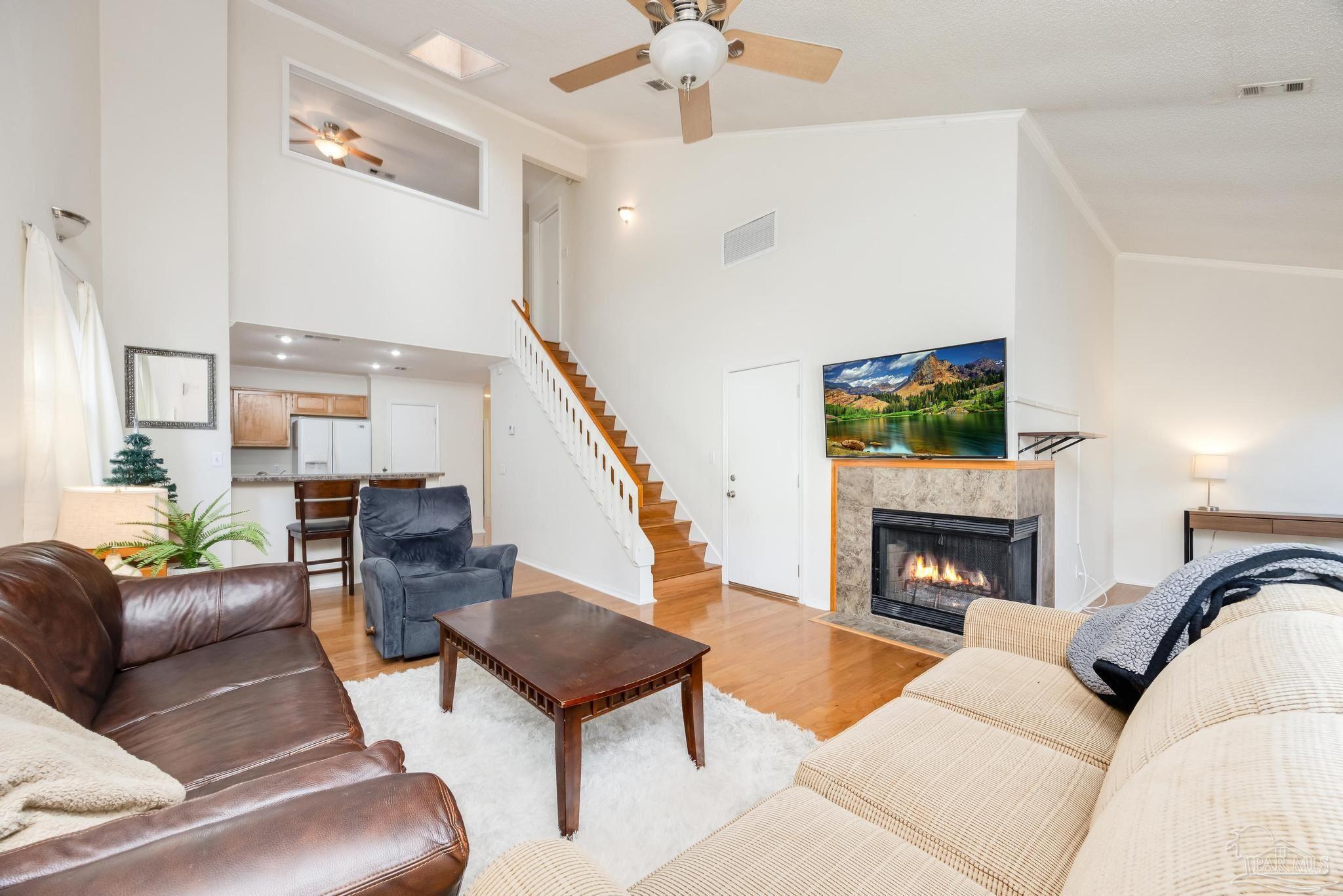 a living room with furniture and a fireplace