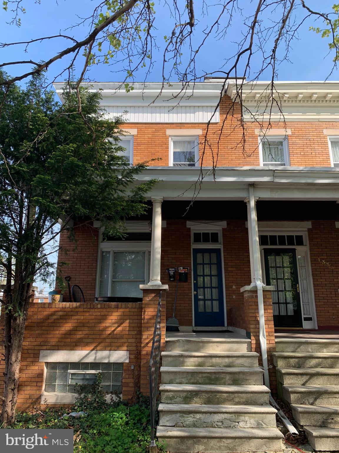 a front view of a house with a porch