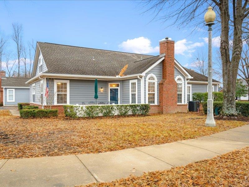 Ranch-style house featuring central AC unit