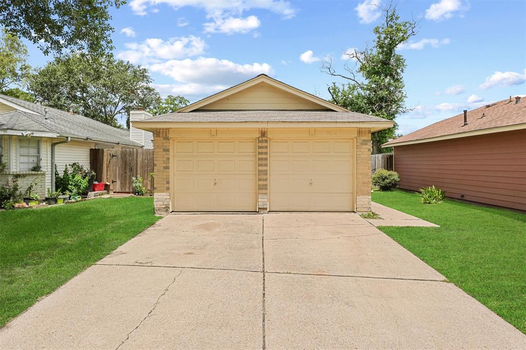 a view of garage and yard with seating space