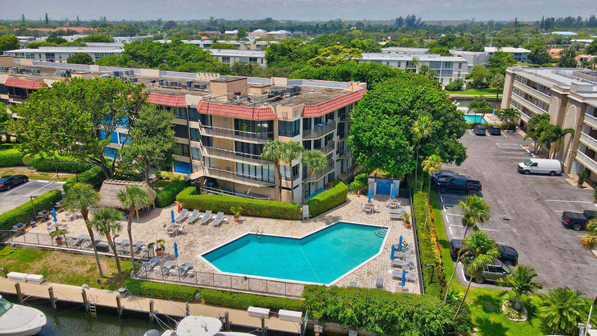 an aerial view of a house with yard swimming pool and outdoor seating