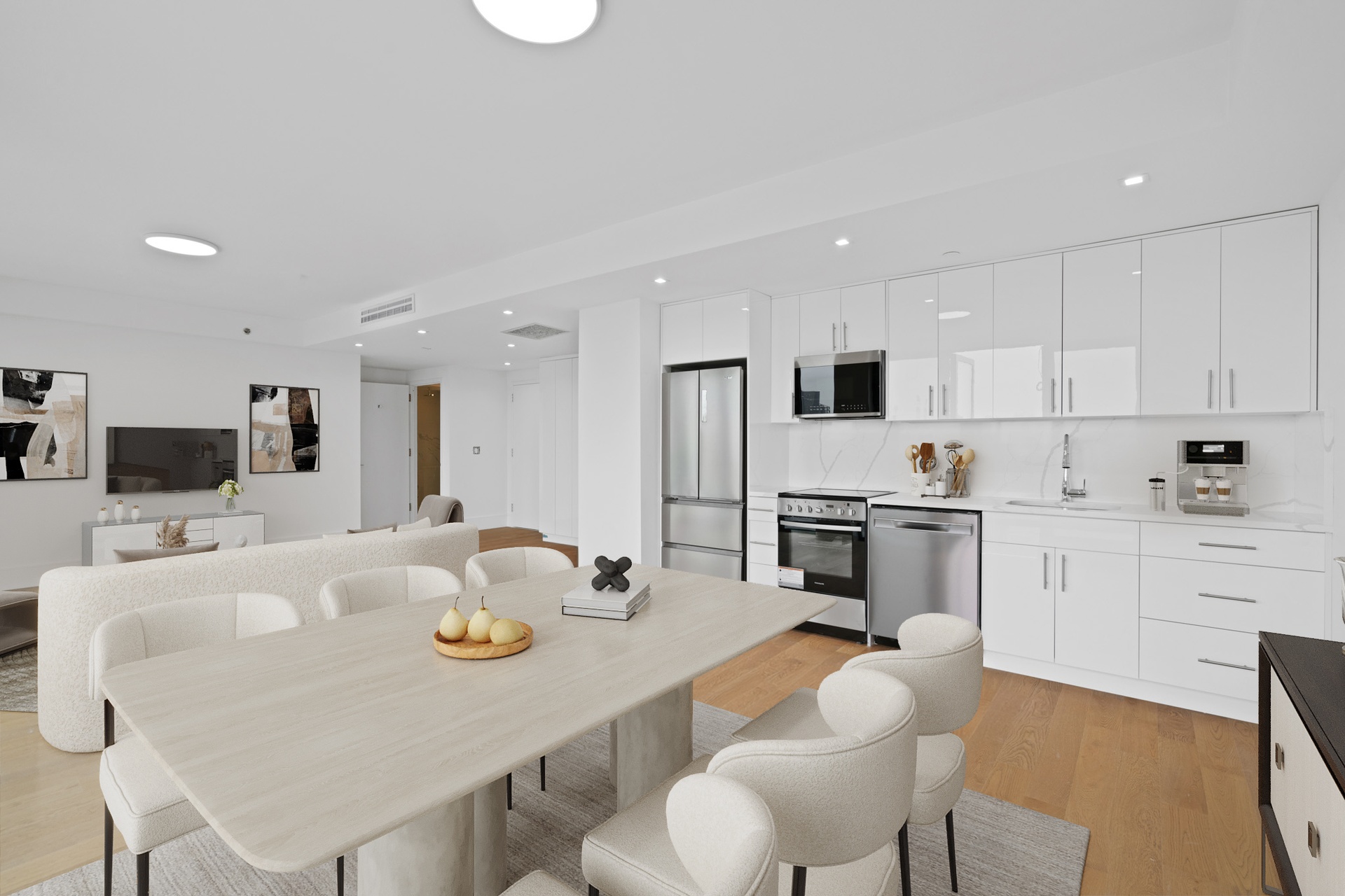 a view of kitchen with kitchen island stainless steel appliances refrigerator stove dining table and chairs