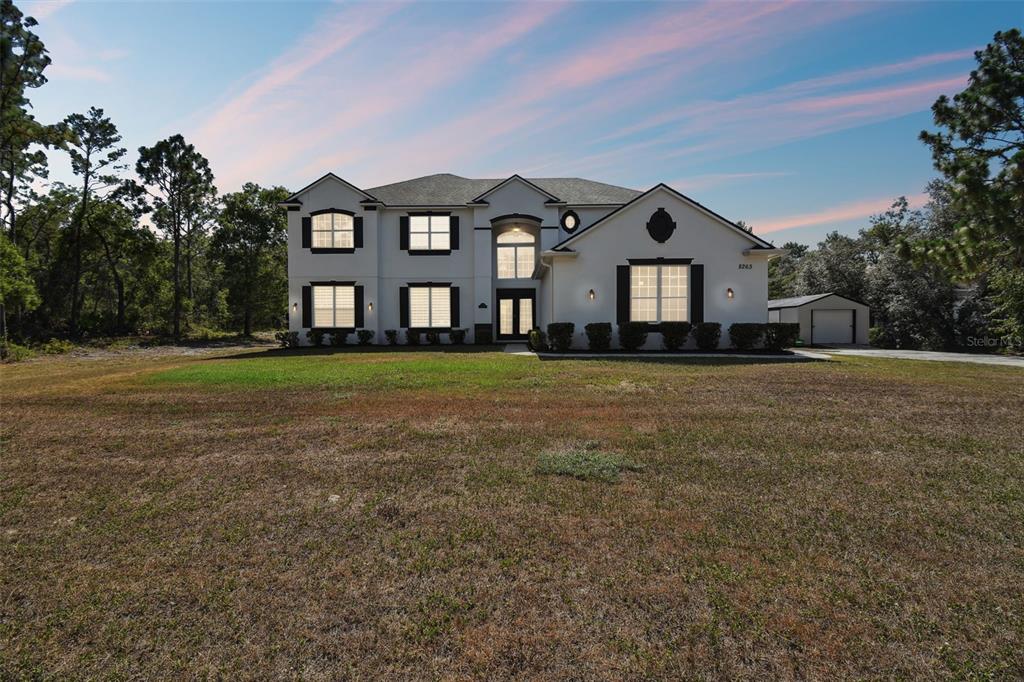 a front view of a house with a yard