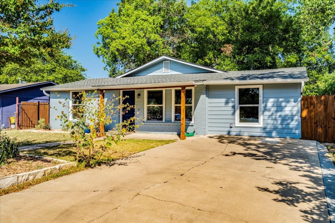 a front view of a house with basket ball court and porch