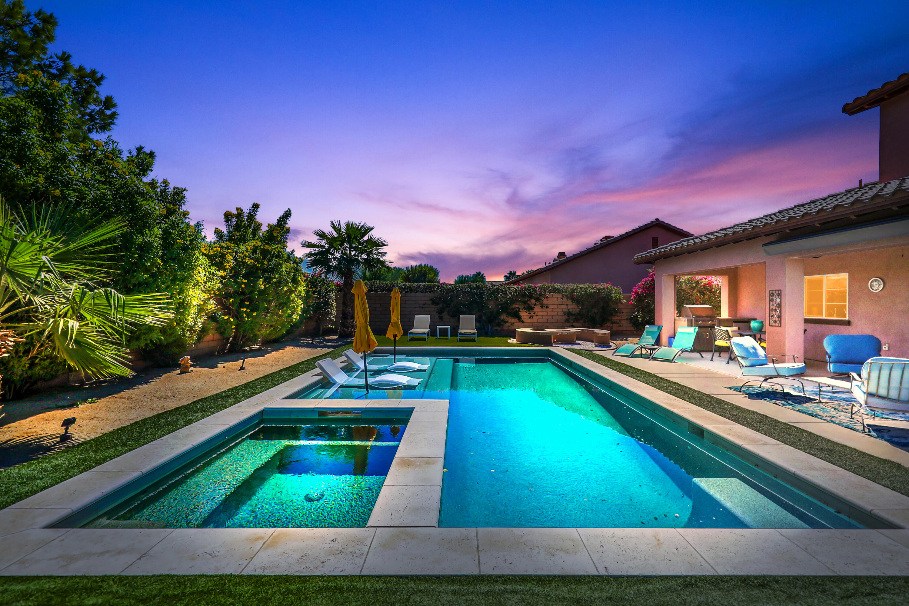 a view of swimming pool with outdoor seating