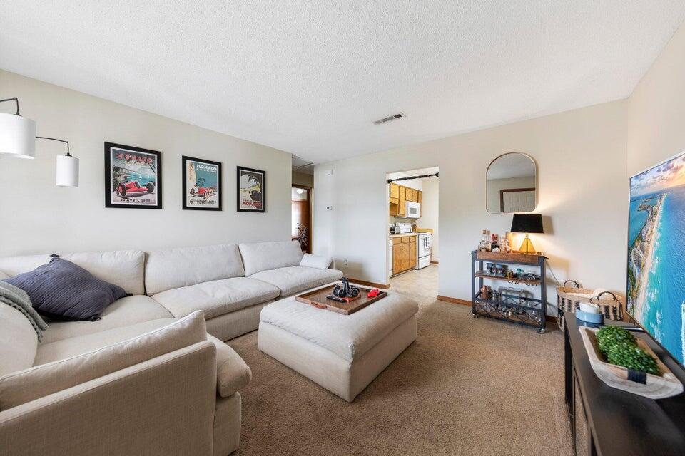 a living room with furniture and a couch