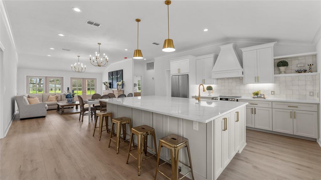 a kitchen with lots of counter space dining table and chairs