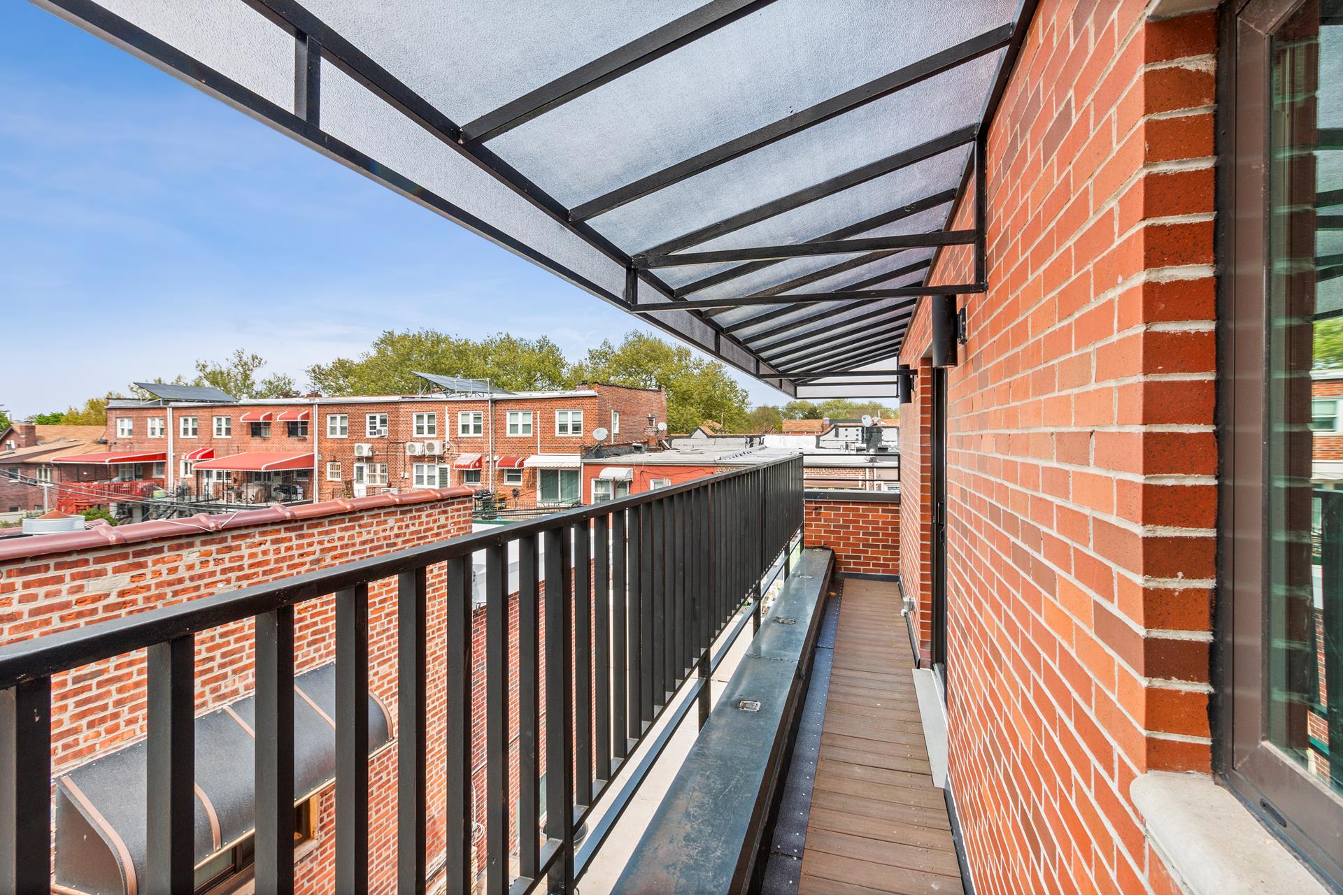 a view of balcony with wooden floor