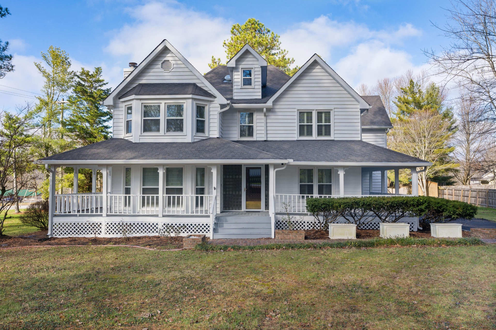 a front view of a house with a garden