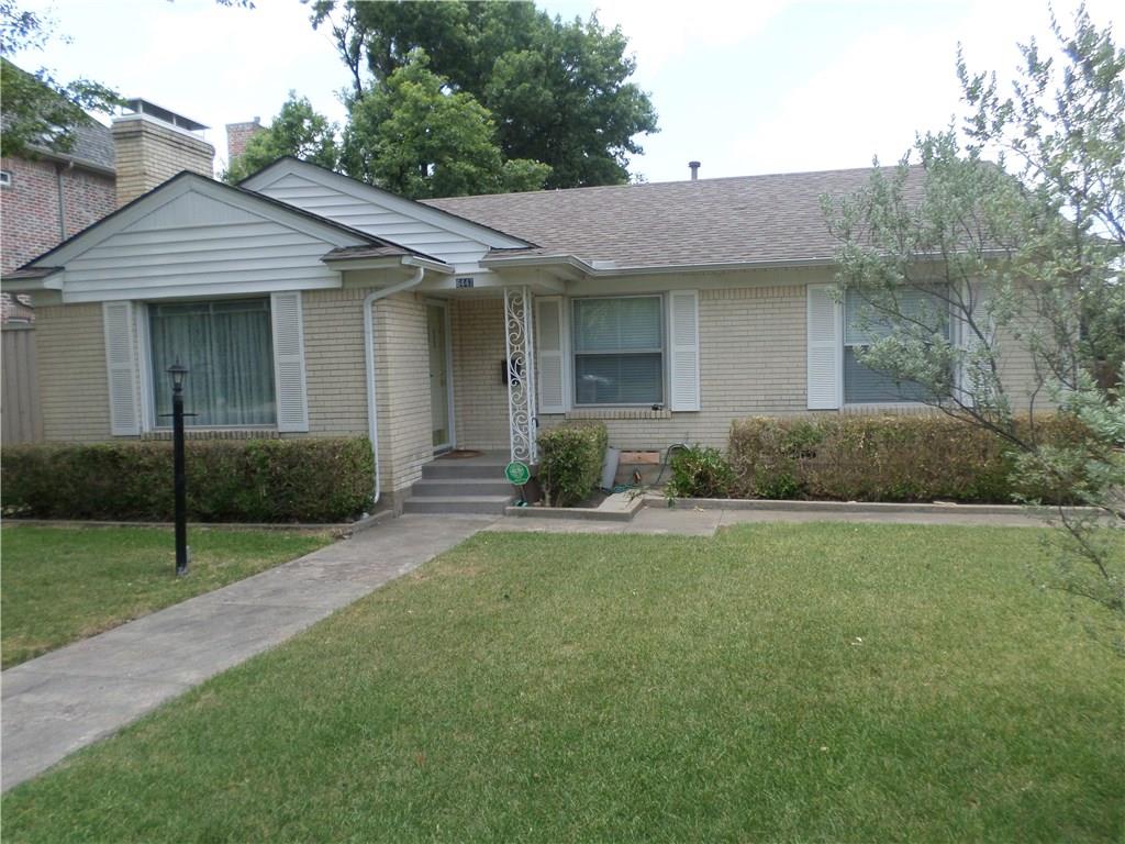 a front view of a house with a yard and porch