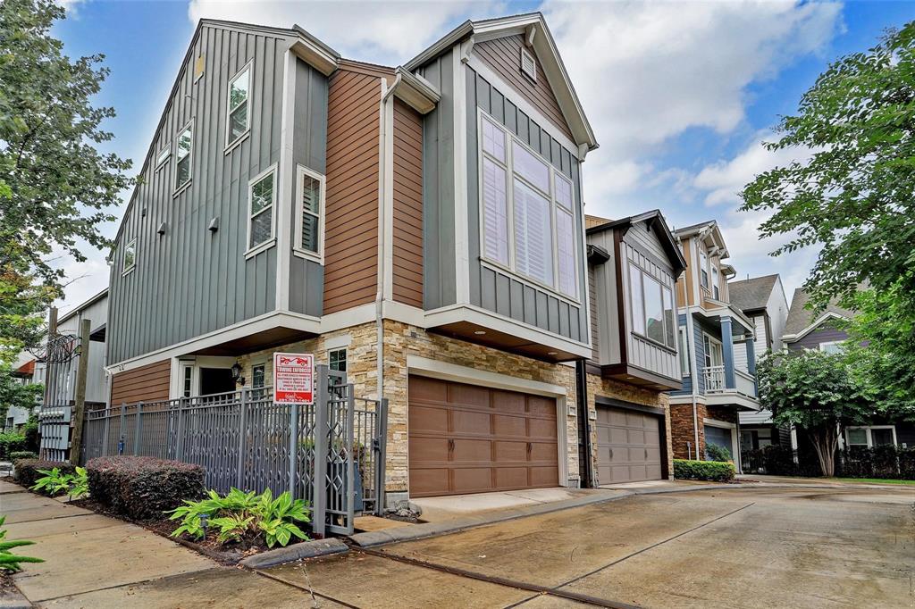 Welcome to 1817 Drew St! This modern three-story townhome, featuring a striking mix of grey, brown, and stone facade. The gated entrance ensures privacy, while large windows flood the home with natural light. Located in a secure community, this residence offers both style and security just minutes from downtown Houston.