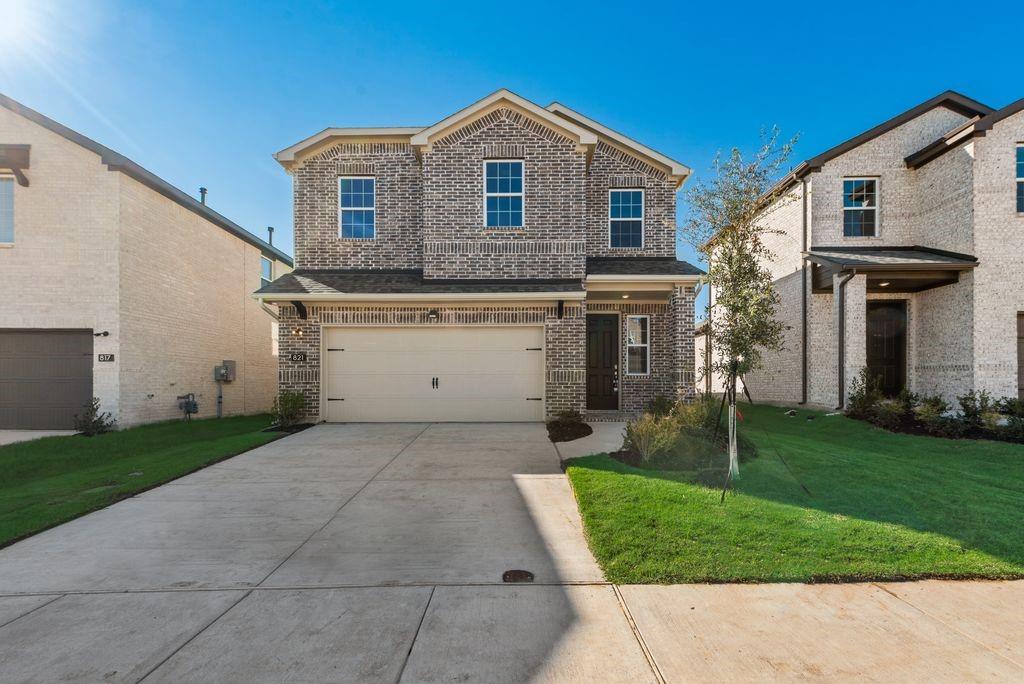 a front view of a house with a yard