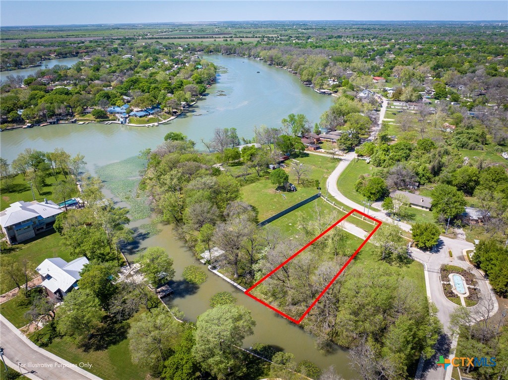 an aerial view of a house with a lake view