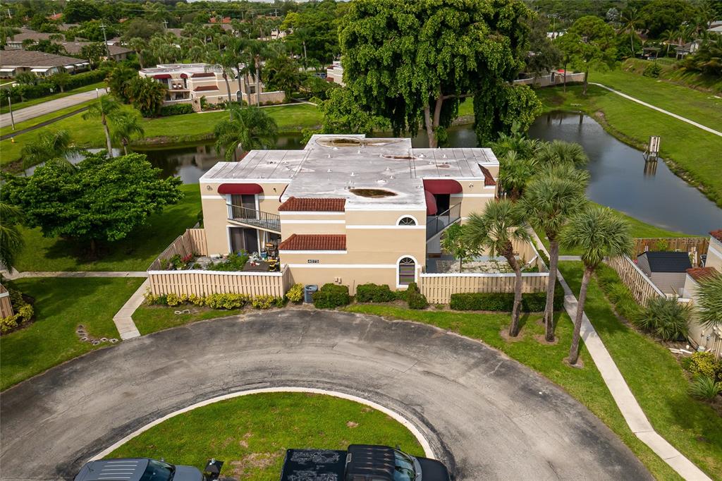 an aerial view of a house with outdoor space