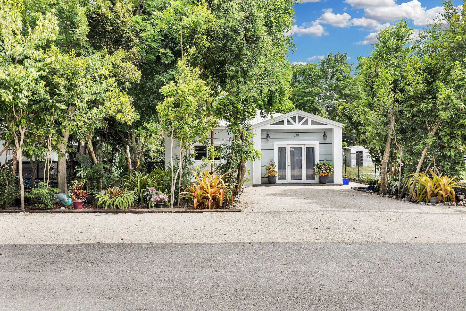 front view of a house with a garden