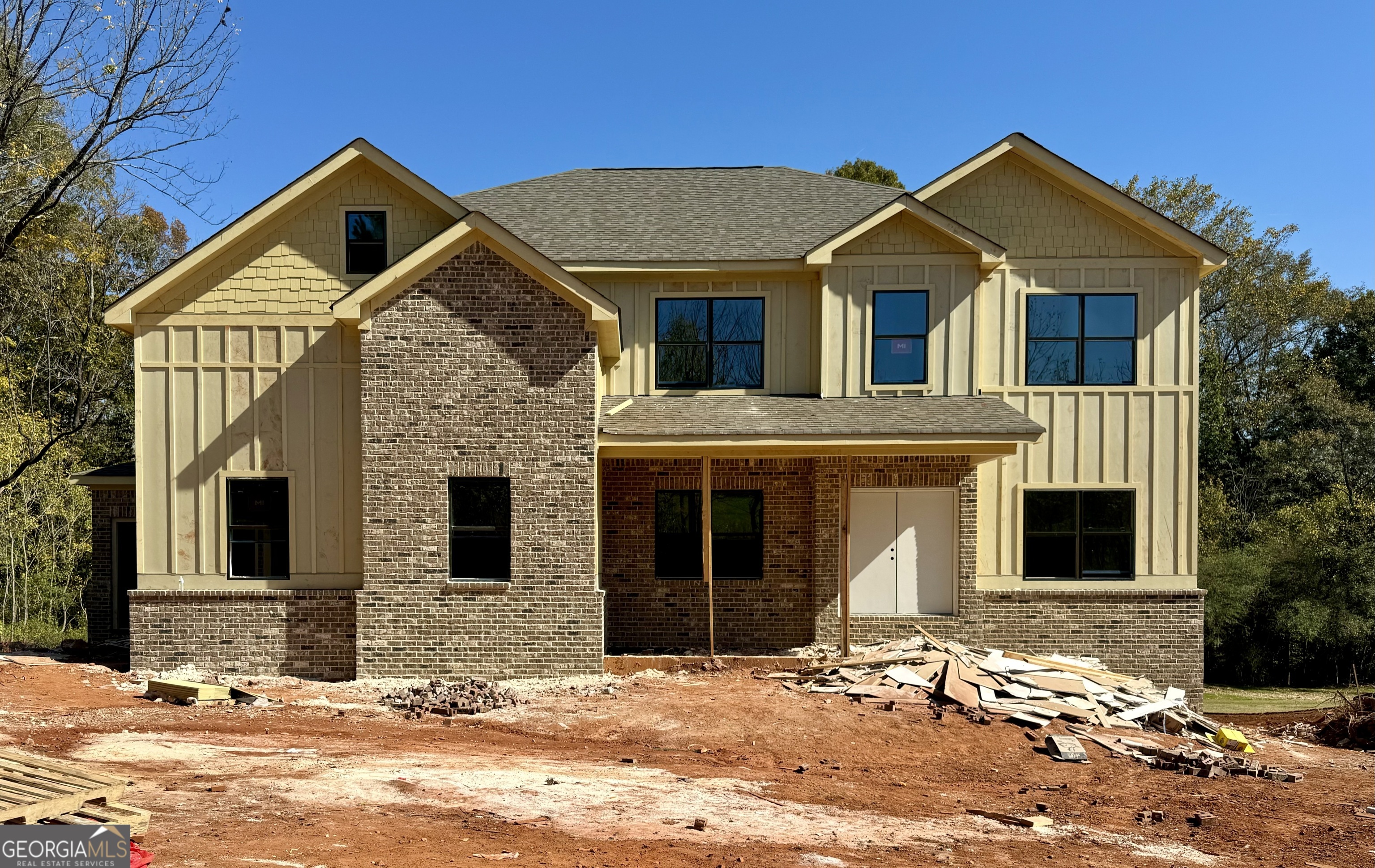 a front view of a house with a yard