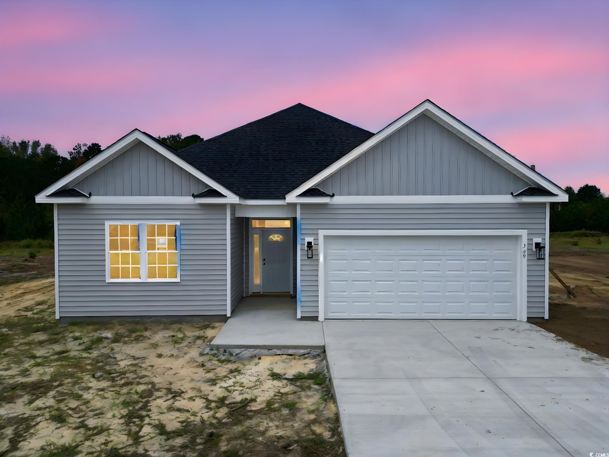 View of front of property with a garage