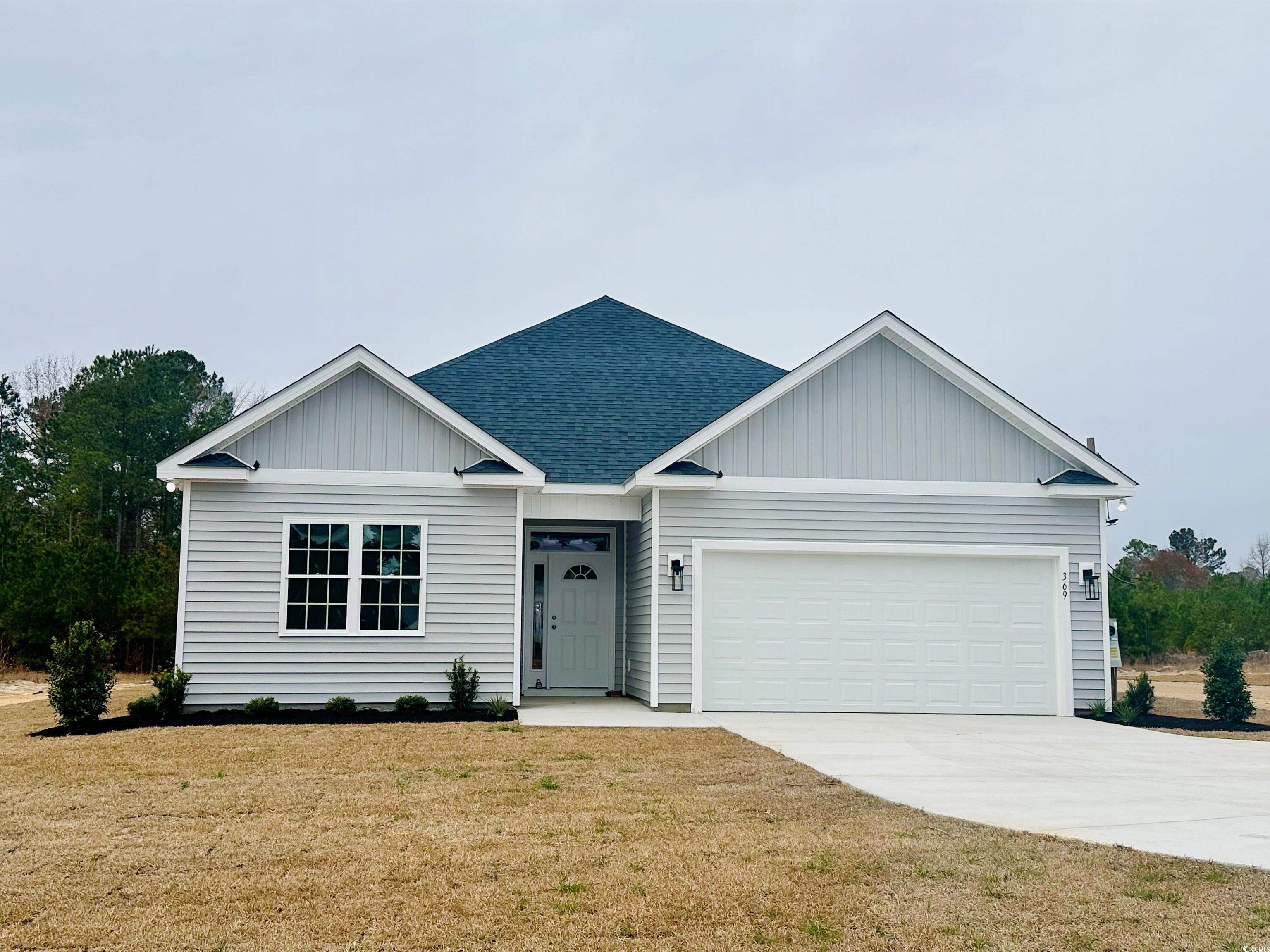 View of front of home featuring a front yard and a