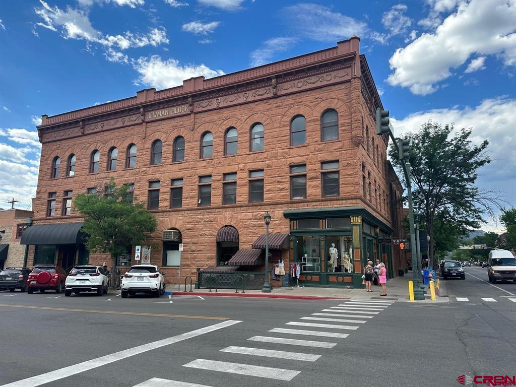 a front view of a building with street view