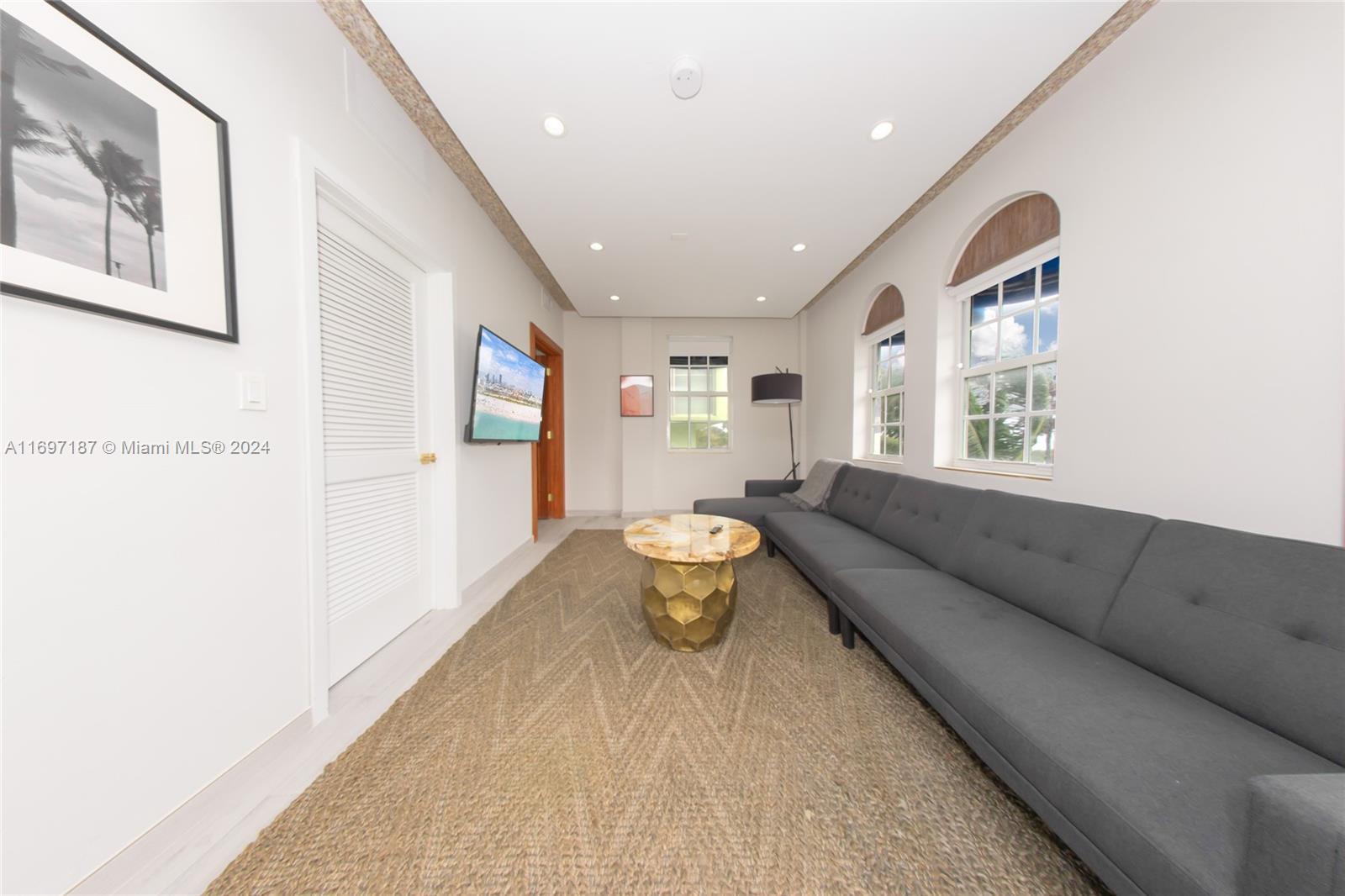 a living room with furniture and a window