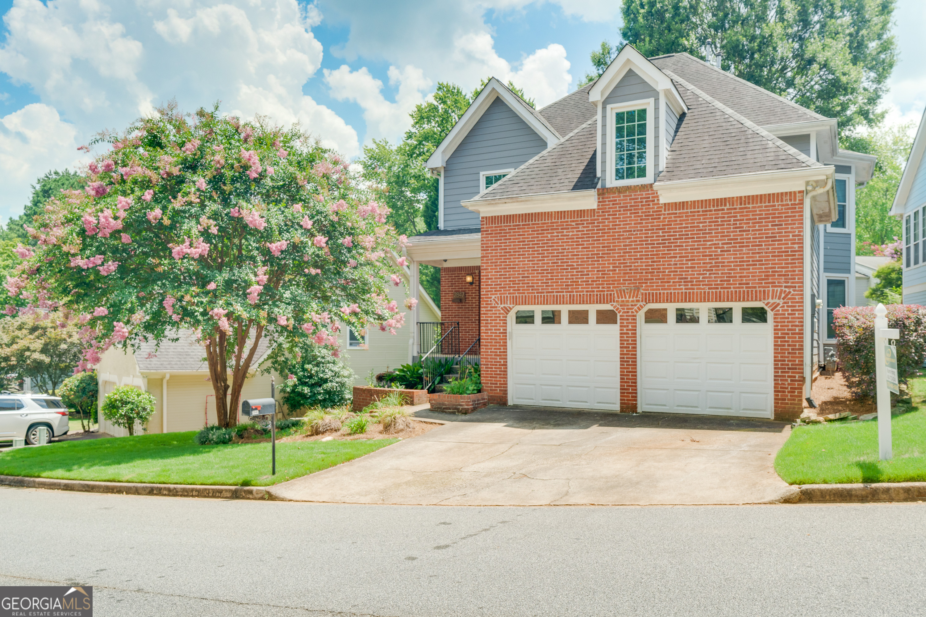 a house with a tree and a yard