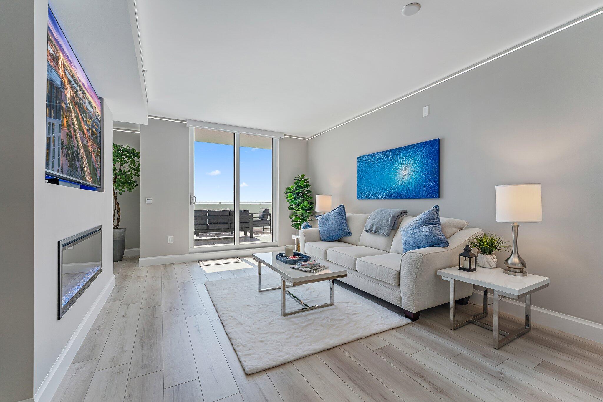 a living room with furniture and a fireplace