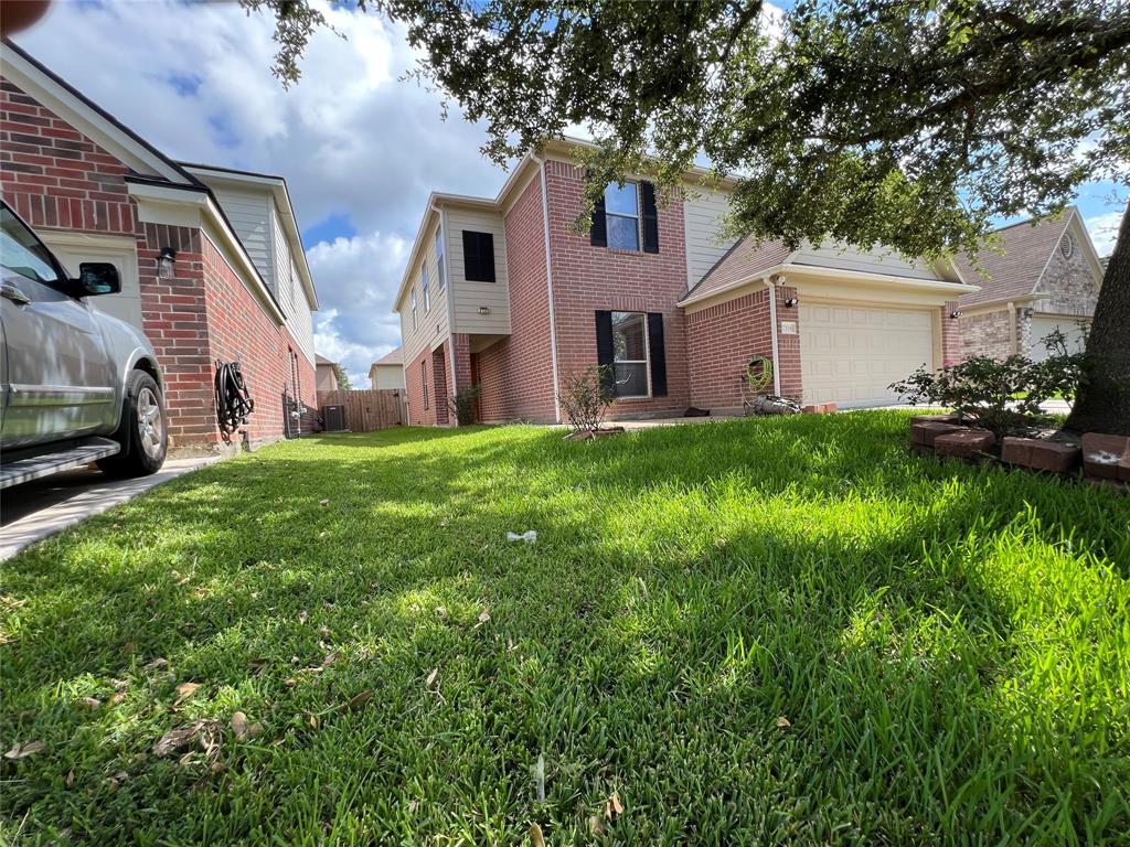 a view of a house with a back yard