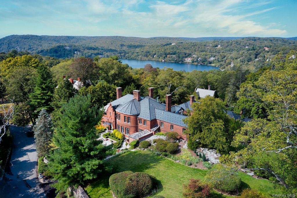 an aerial view of a house with a lake view