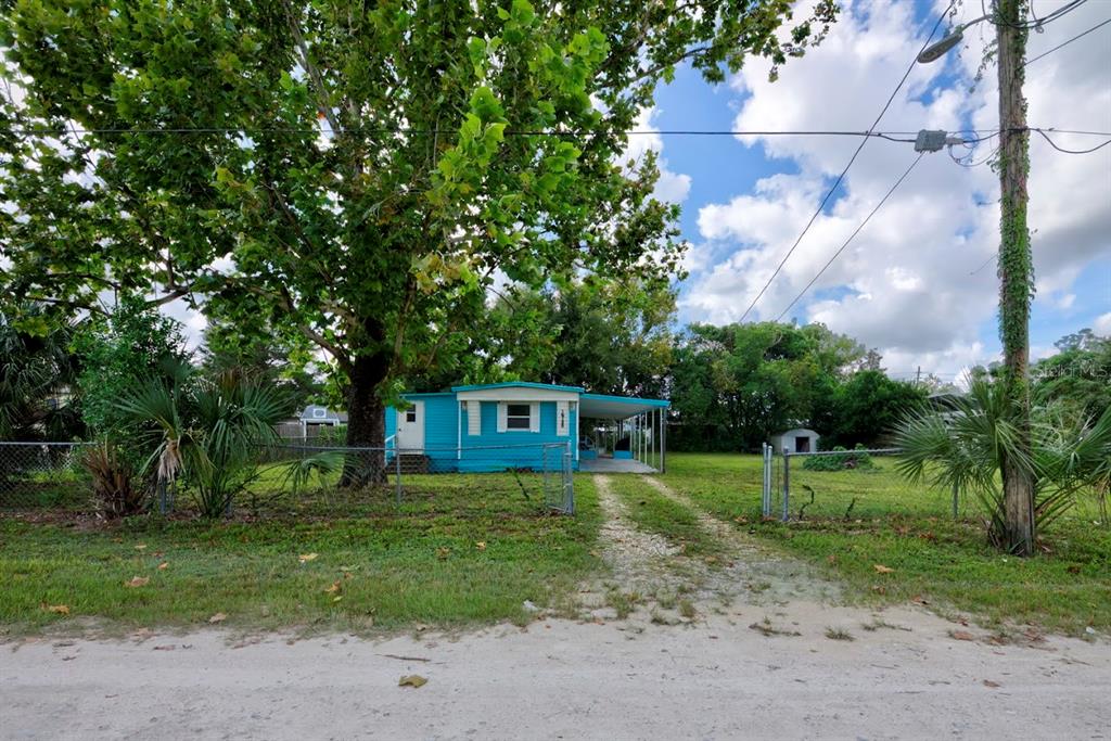 a view of a house with a big yard