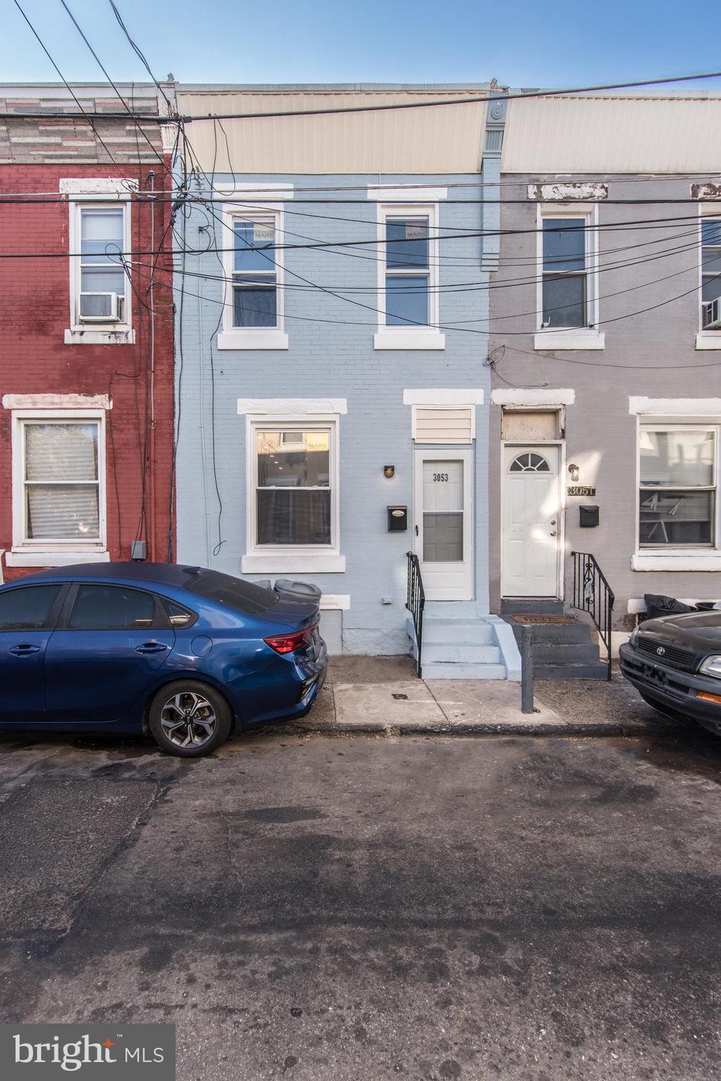 a car parked in front of a house